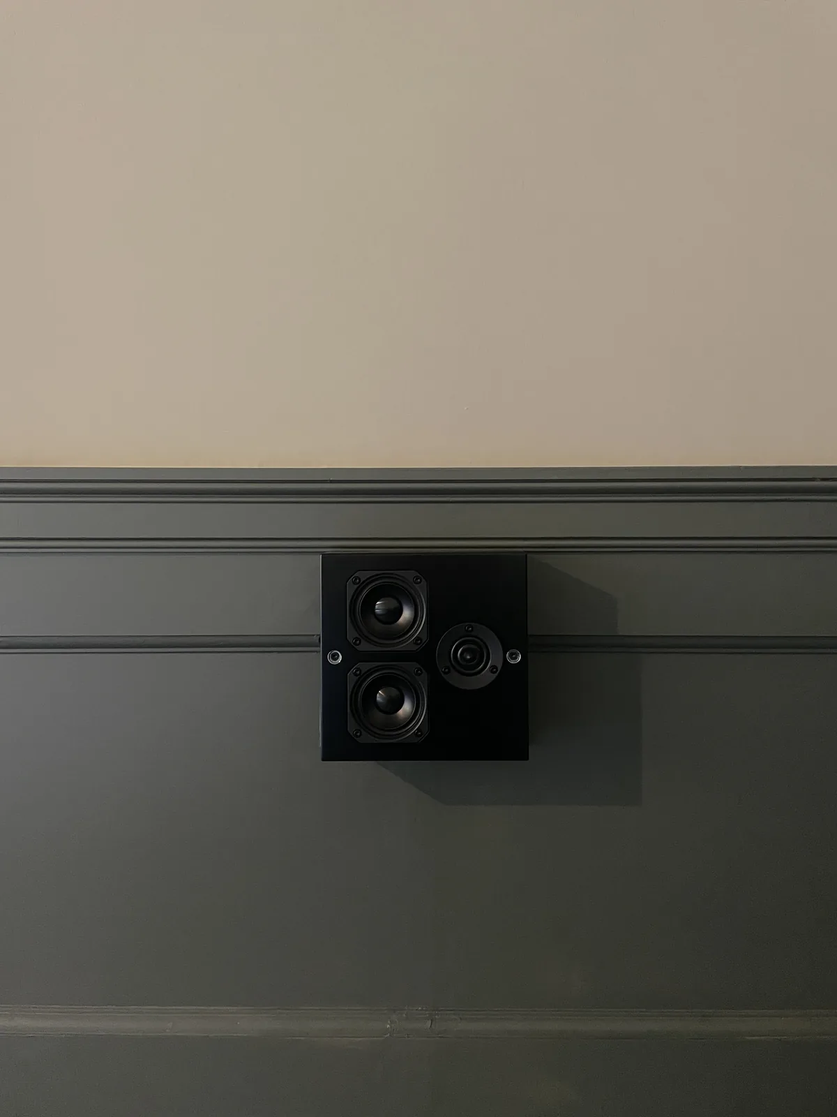 Artcoustic loudspeakers set into timber wall panelling