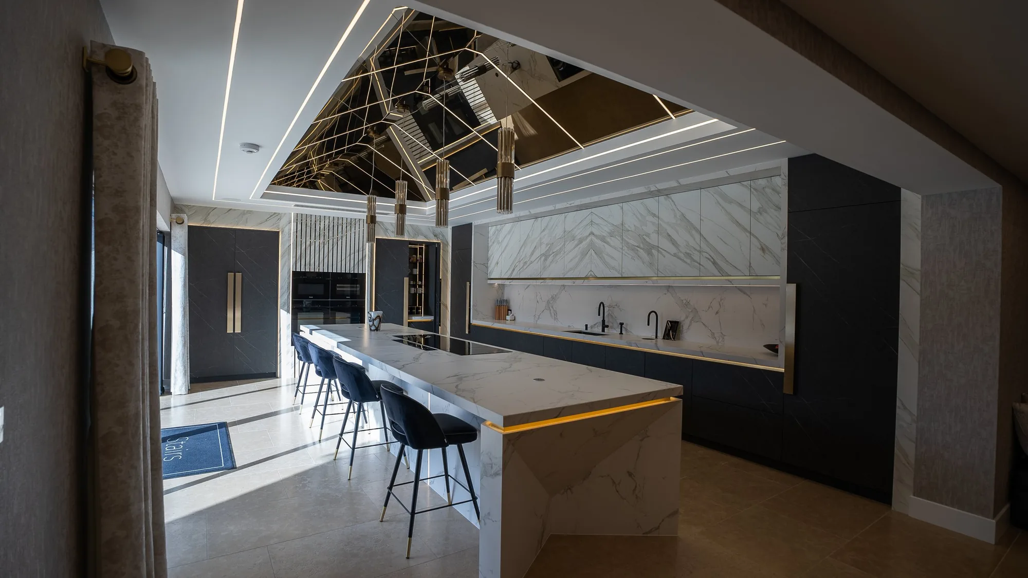 The kitchen and island at night
