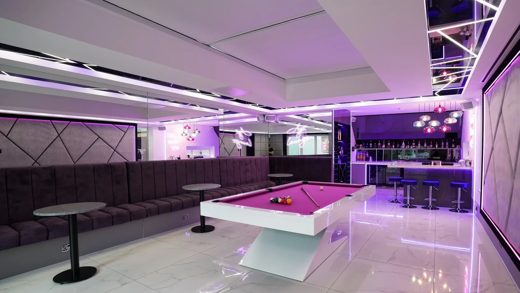 The same games room with the roof light blind closed, the ceiling reading as a flat plane