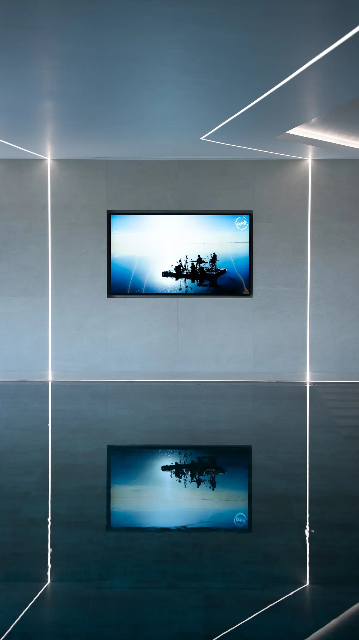 A screen mounted flush into a minimal wall