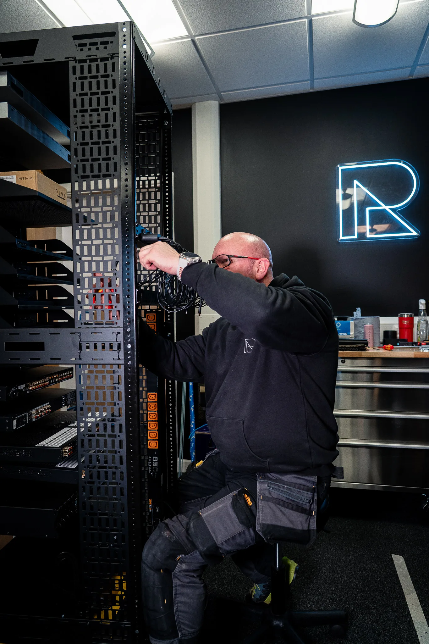 An engineer building a rack in the Ribble AV workshop